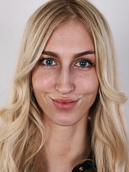 Tall blue-eyed blonde girl looking very seductive