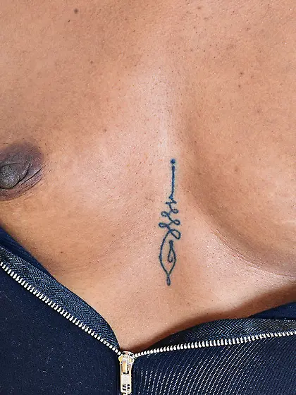 Flat Ebony whore performs striptease and advertises her pussy on