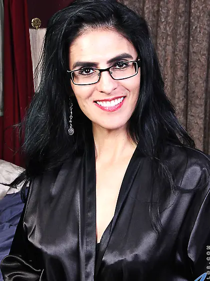 Woman in a black robe is going to sleep but desire to masturbate