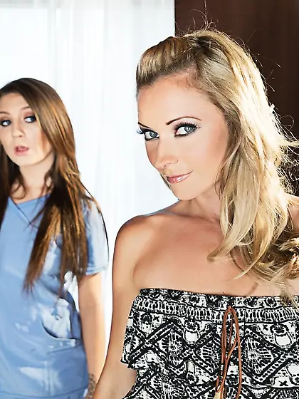 Brunette masseuse blue scrubs