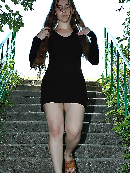 Pissing on outdoor concrete ladder