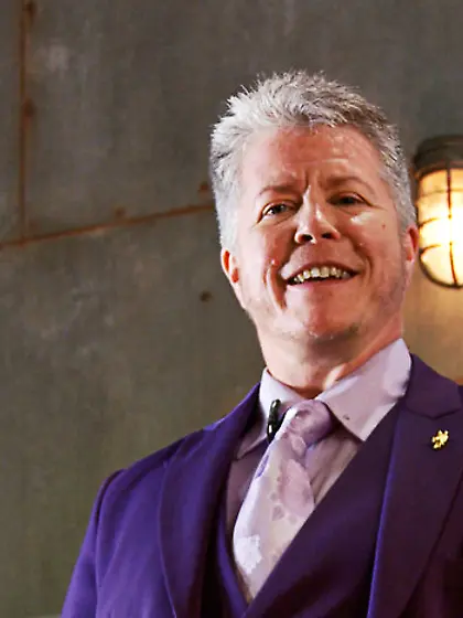 Dude purple suit discusses