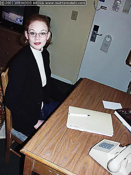 Perky titted redhead Justine Joli with pink pussy poses in white