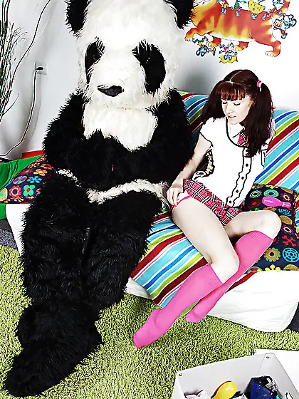 Pigtailed girl takes panda's huge fake dick all over
