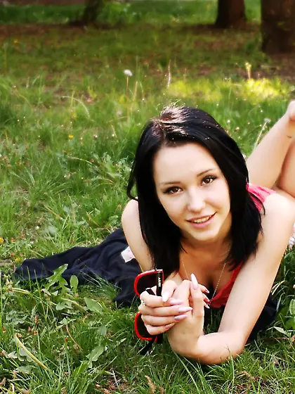 Skinny brunette babe Eleonora B naughtily plays outdoors showing