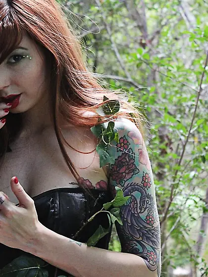 Beautiful inked redhead Ivy Jean shows off her butt and tits in