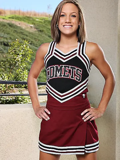 Petite cheer girl Kara Novak with bald pussy takes off her unifo