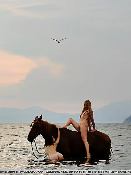 Naked slender lesbian friends Dariya A and Lera B ride the horse