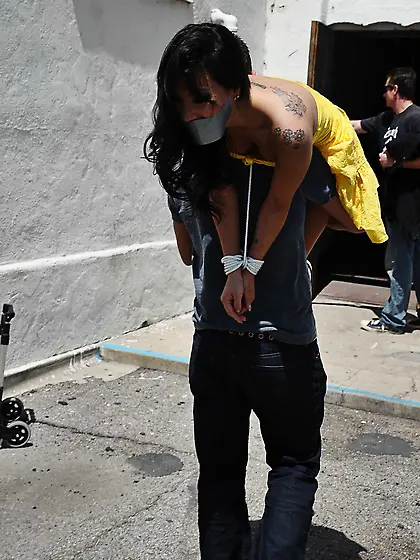 Asian pornstar is tied up and used by a bunch of gang members