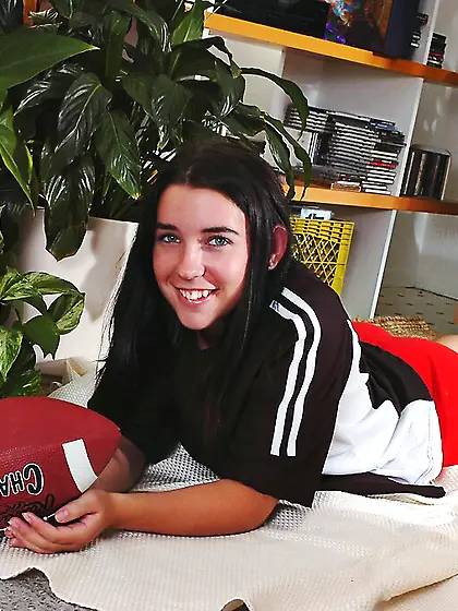 Dark haired bad girl Alexis Ryan in red shorts shows her hairles