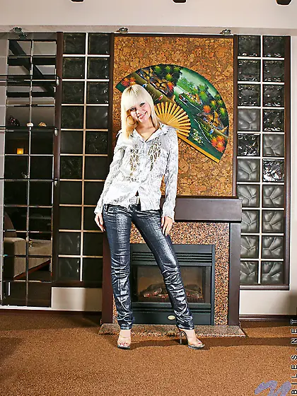 Petite young darling with a skinny body takes off her glossy out