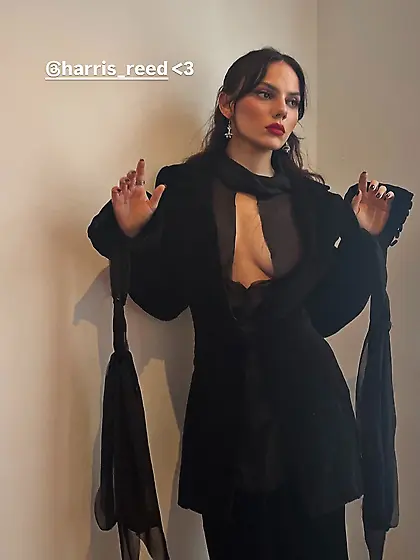 Dafne Keen in a black dress