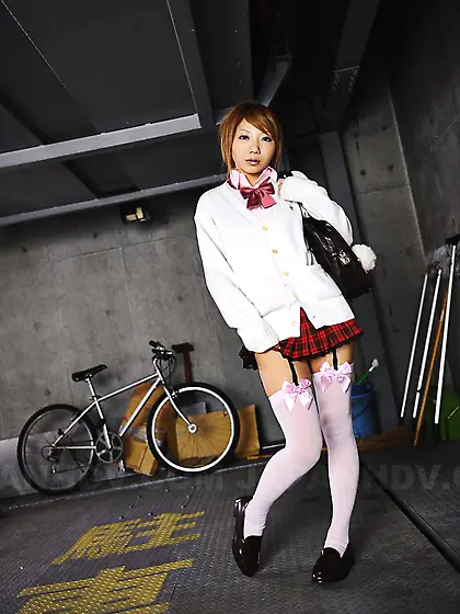 Sexy Asian schoolgirl Rui Hazuki is erotically posing and gently