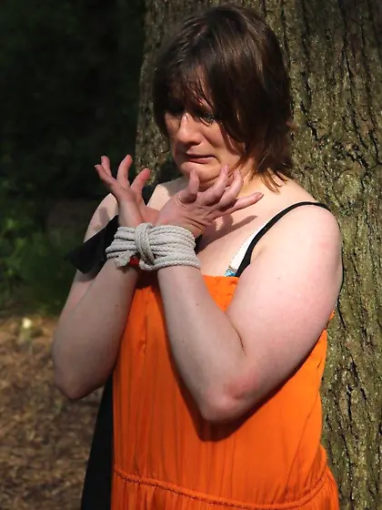 Helpless housewife is captured by lover and tied up to tree in p