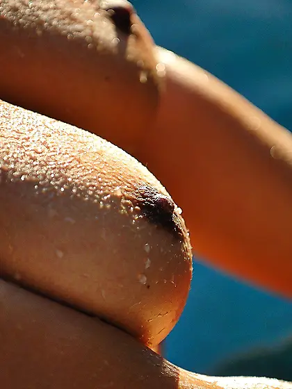 Purple dress babe shows her wet boobs and teases the camera as w