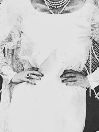 Vintage adult movie star Candy Samples in bridal garment