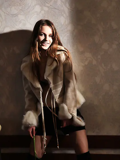 Wavy-haired hottie dressed in black gets naked in a hotel room V