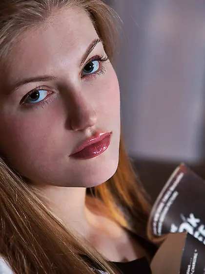 Blond-haired and flat-chested bombshell shows that dripping slit