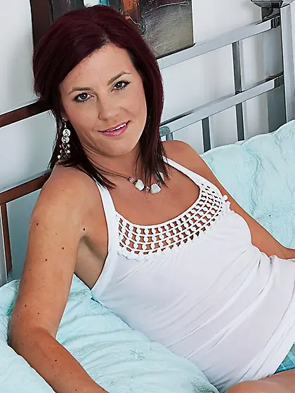 Good looking slim milf beauty Sofia Matthews removes her panties