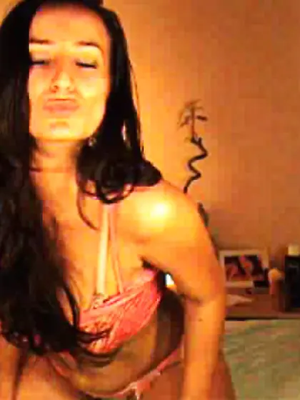 Cool long-haired chick undresses