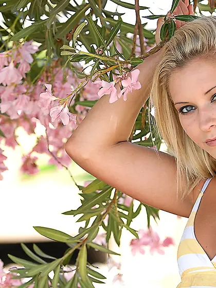 Cute blond babe,  Lena Biddle gets off her yellow stripped white