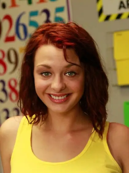 Busty redhead schoolgirl teases