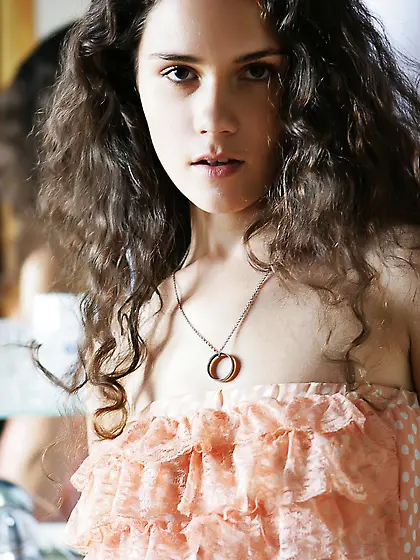 Foamed water is petting the beautiful smooth boobs of hot brunet