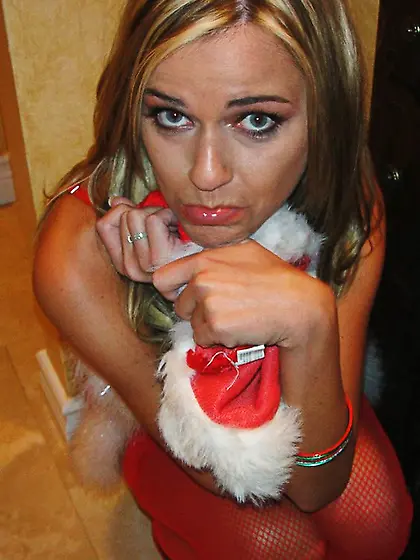 Horny Santa helper poses in a tiny outfit but later gives her bo