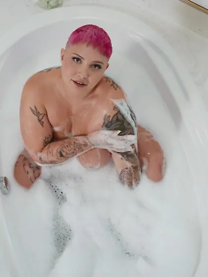 Pink-haired plumper Jadynn Stone sucks and tit fucks firm cock b