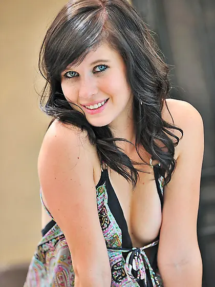 Effortlessly cute brunette with tattoos doing kicks and showing