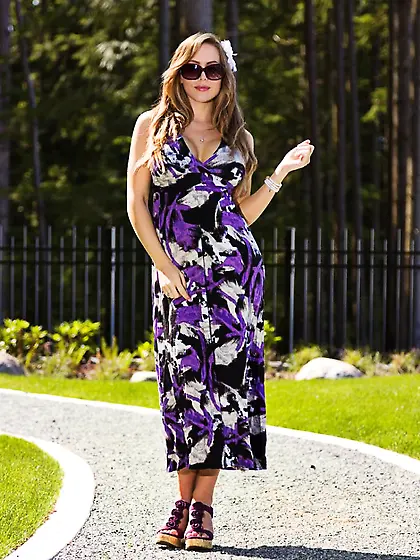 Slender beauty Katie Banks sit on drive way spread her legs and