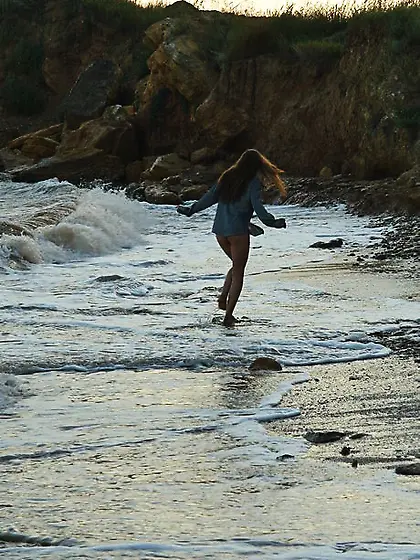 Young sexy cutie gets wet and naked when posing playfully in the