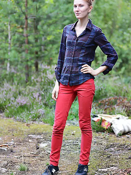 During walk in the park skinny blonde takes off clothes and pose