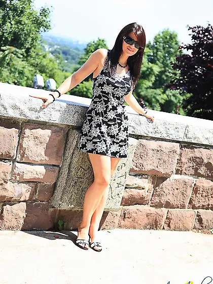 Ann Angel in pretty short summer dress exposes her legs and flas