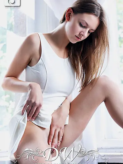 Rebeka Ruby poses naked on the windowsill