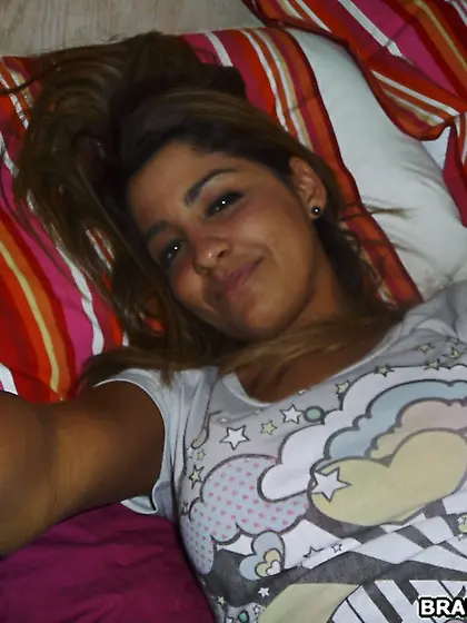 Brandi Belle teases us on the bed as she pulls down her sexy nyl