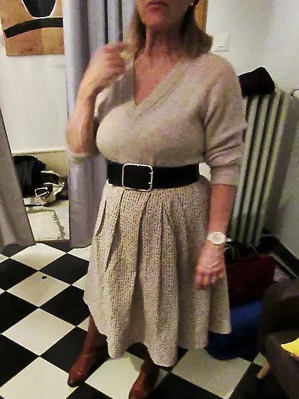 Her petticoat pressed her breasts forward