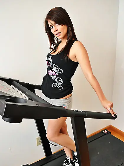 Charming brunette gal interrupts workout to flaunt her naked tee