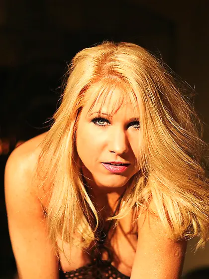 Suzanne Winters gets rid of her cute and sexy fishnet corset and