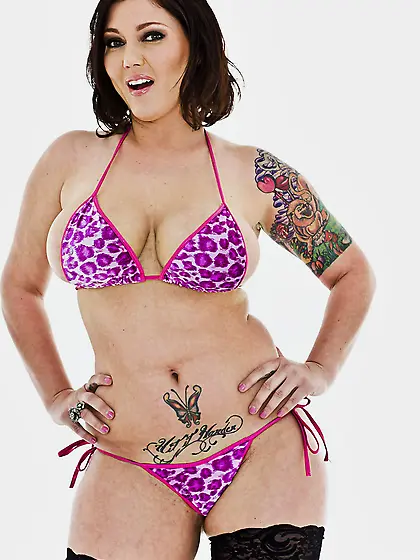 Curvaceous MILF with curvy inked body strips to fishnets and pos