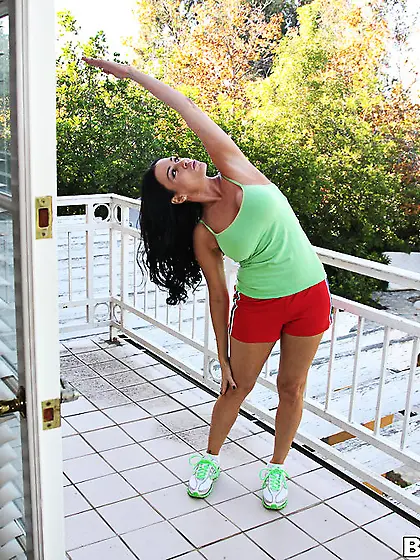 Vanilla Deville takes her sexy outfit in front of the camera and