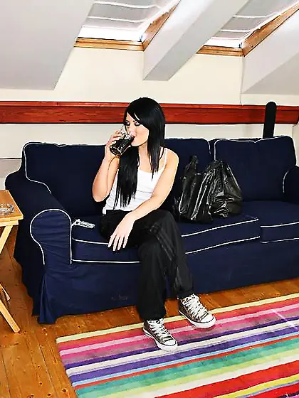 Alluring brunette model Madison Parker strips on the sofa and ge