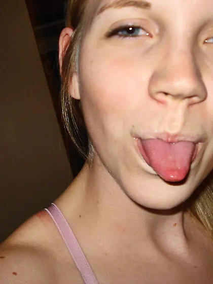 Cute blonde teen Taylor True strips her pink bra and shows her b