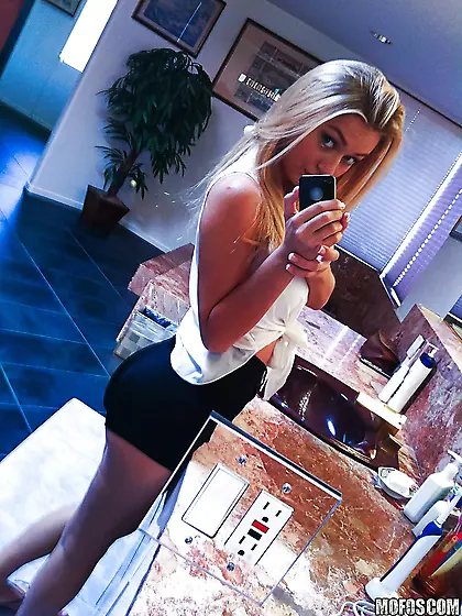 Gorgeous blonde girl Natalia Starr seductively poses in front of