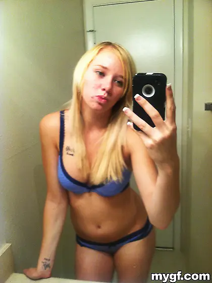 Innocent looking blonde teeny showing off her gorgeous body and