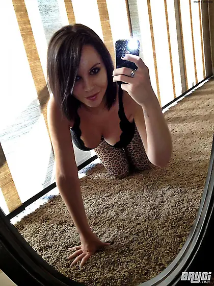 Naughty brunette Bryci in panties and bra pulls out her big tits