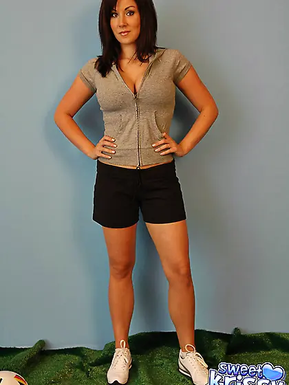 Cute teen babe Sweet Krissy takes off her black shorts and shows