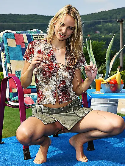 Blonde teen Aneta J Alsscan gets nude and fucks her bald pussy w