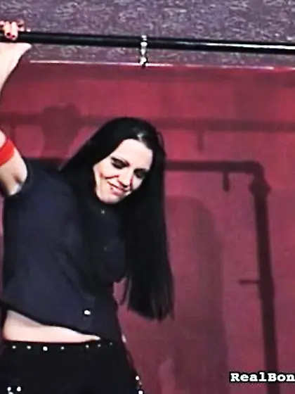 Brunette doll-face undressed tied