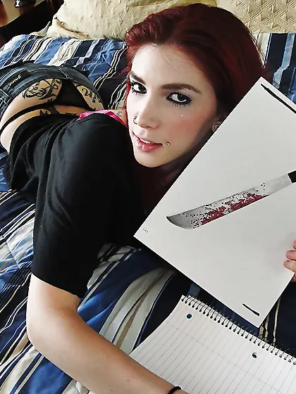 Tattooed redhead strips down to panties and shows off her pierce